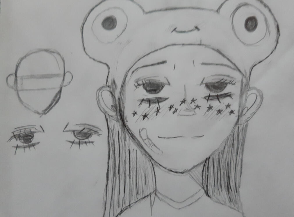 a girl in a frog cap